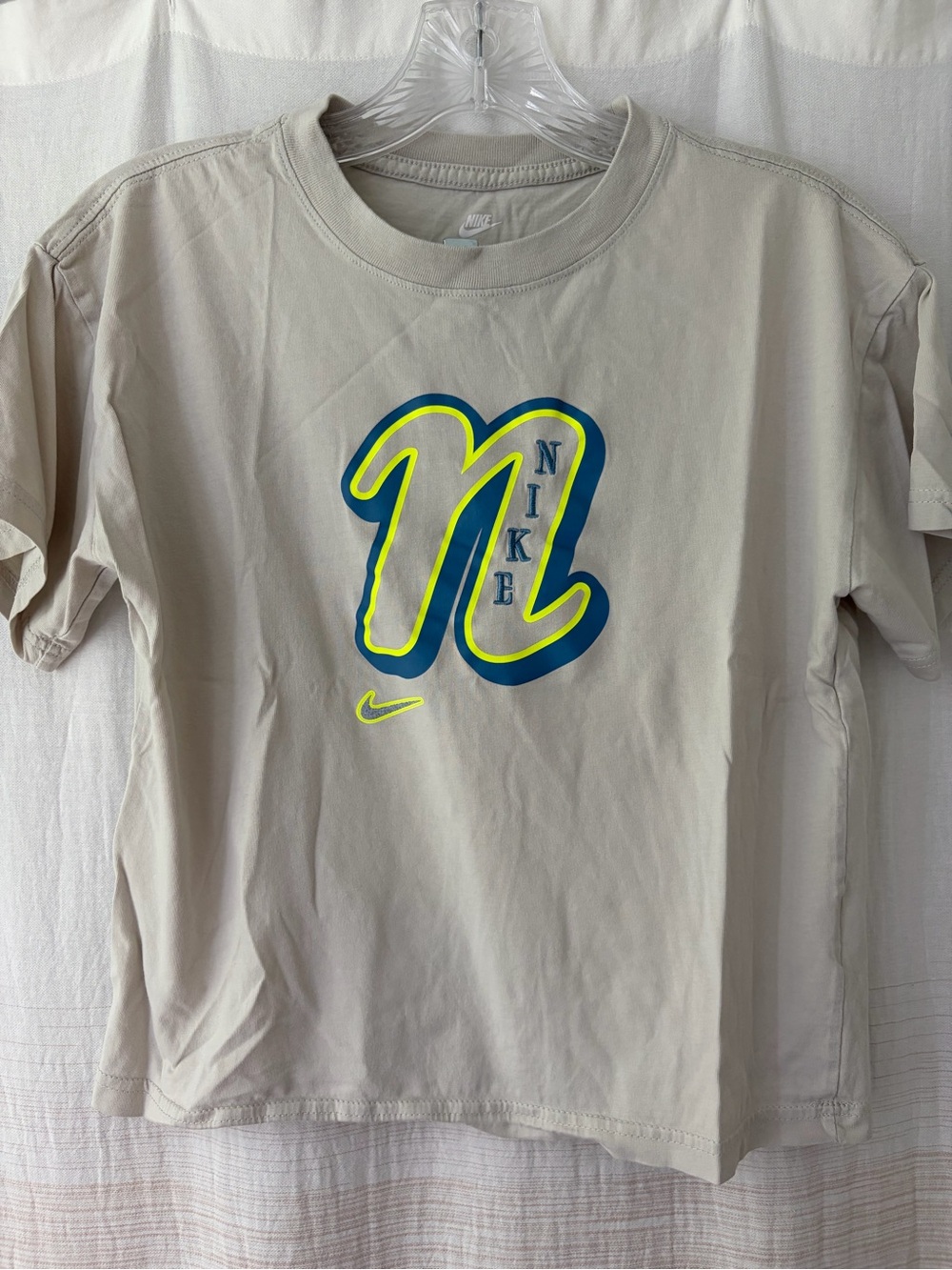 Nike Girls' Beige Graphic Logo Tee with Neon Accent